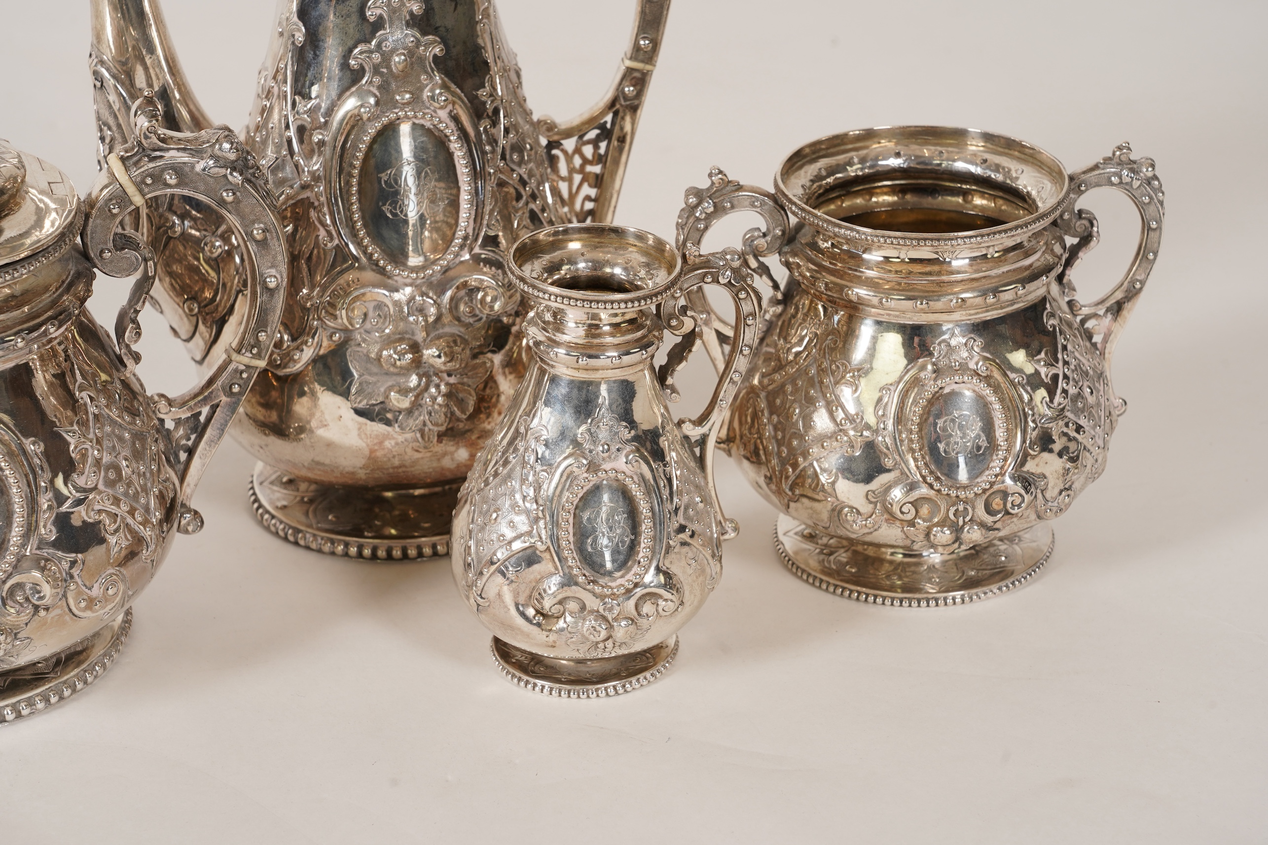 A Victorian ornate silver four piece tea and coffee service, by Thomas Smily